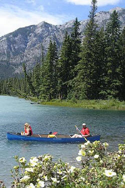 Canoers ona mountain river near Banff. Every bend of every river is so scenic that even a quick "jump out of the car and get a snapshot of that" returns a breath-taking memory.